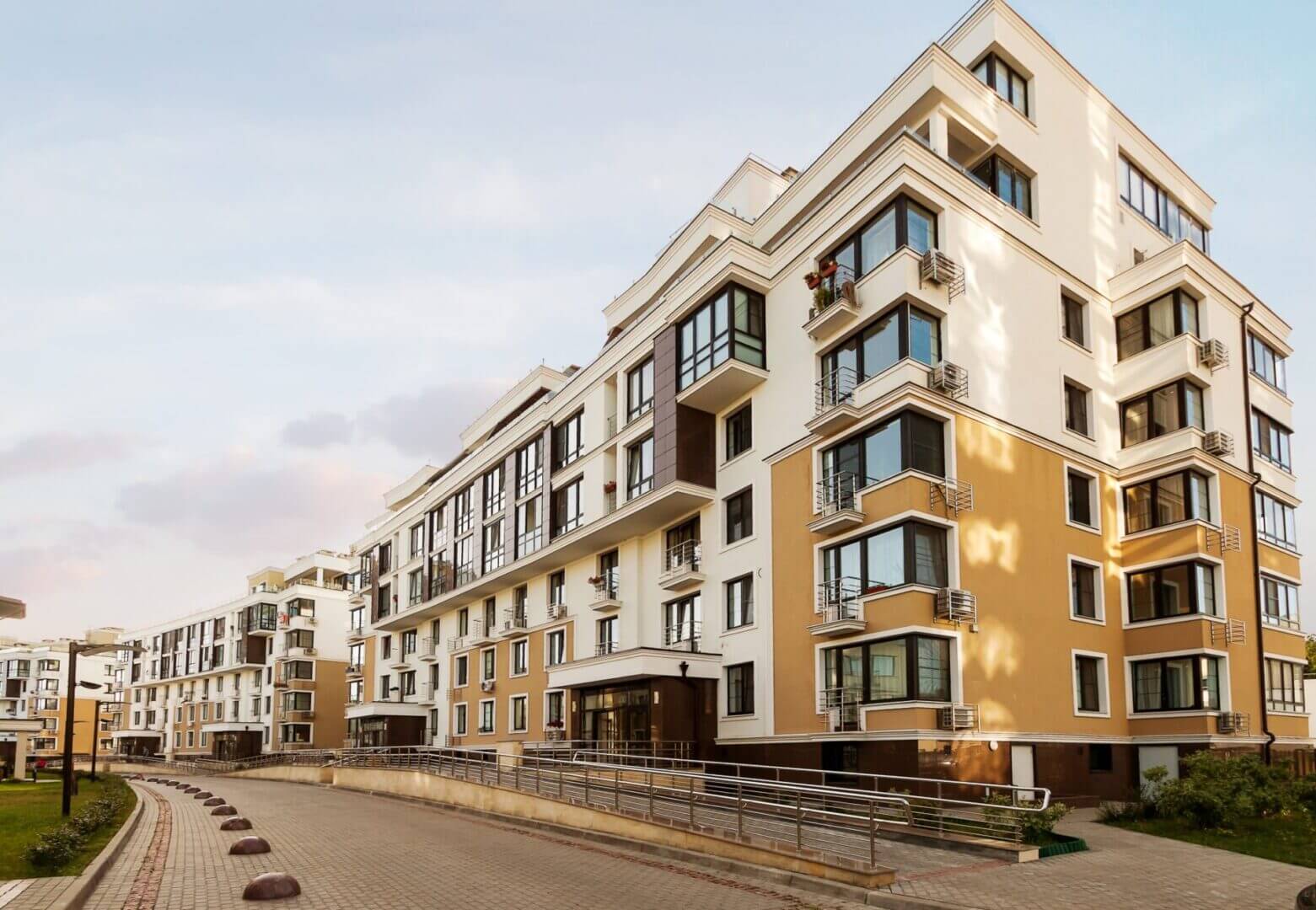 Modern apartment building with multiple balconies.