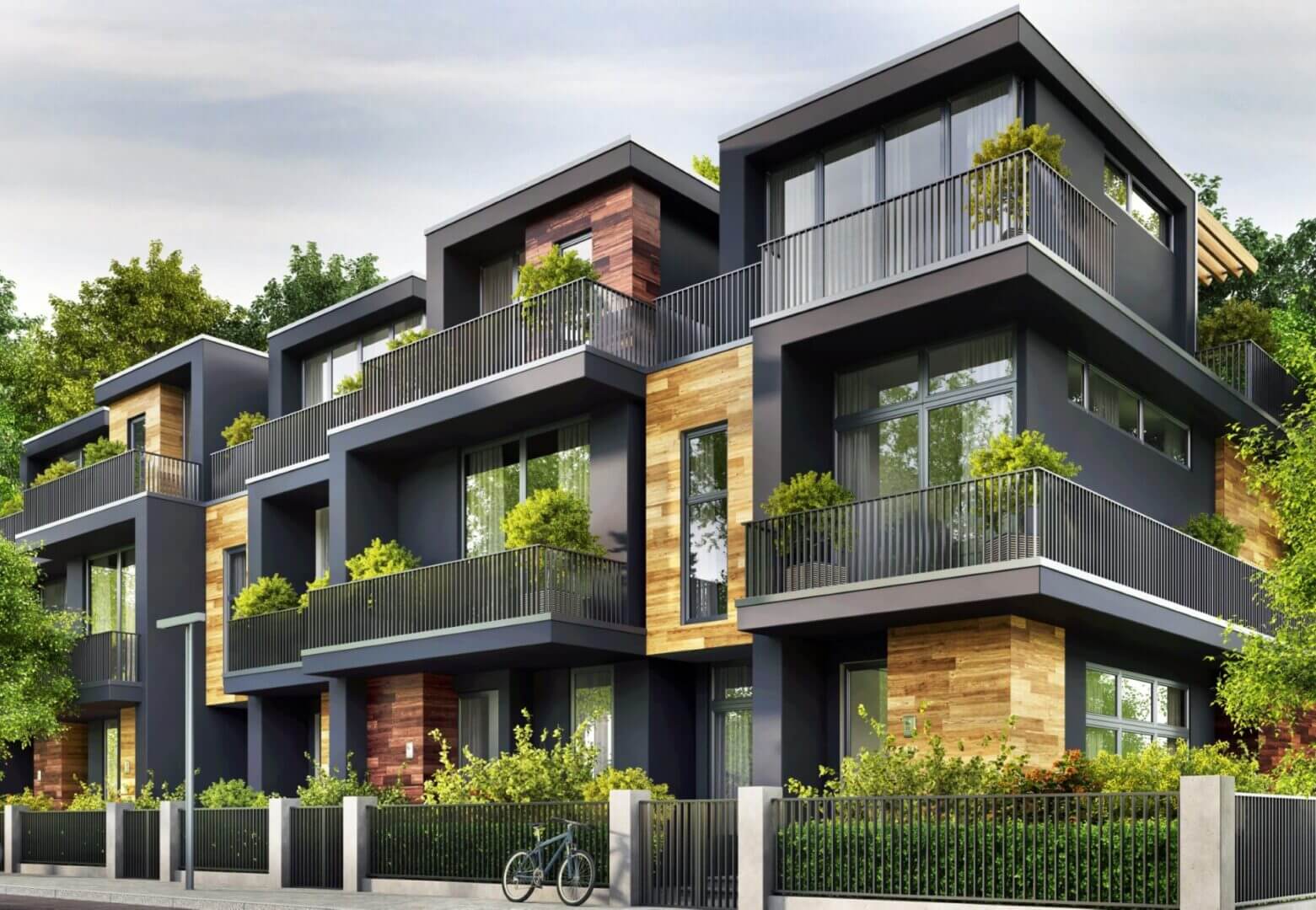 Modern apartment building with greenery outside.
