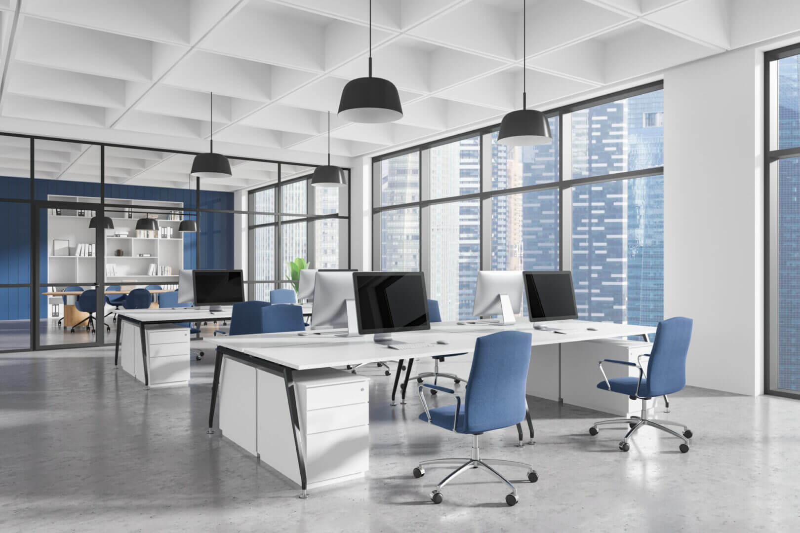 Modern office space with blue chairs and large windows.